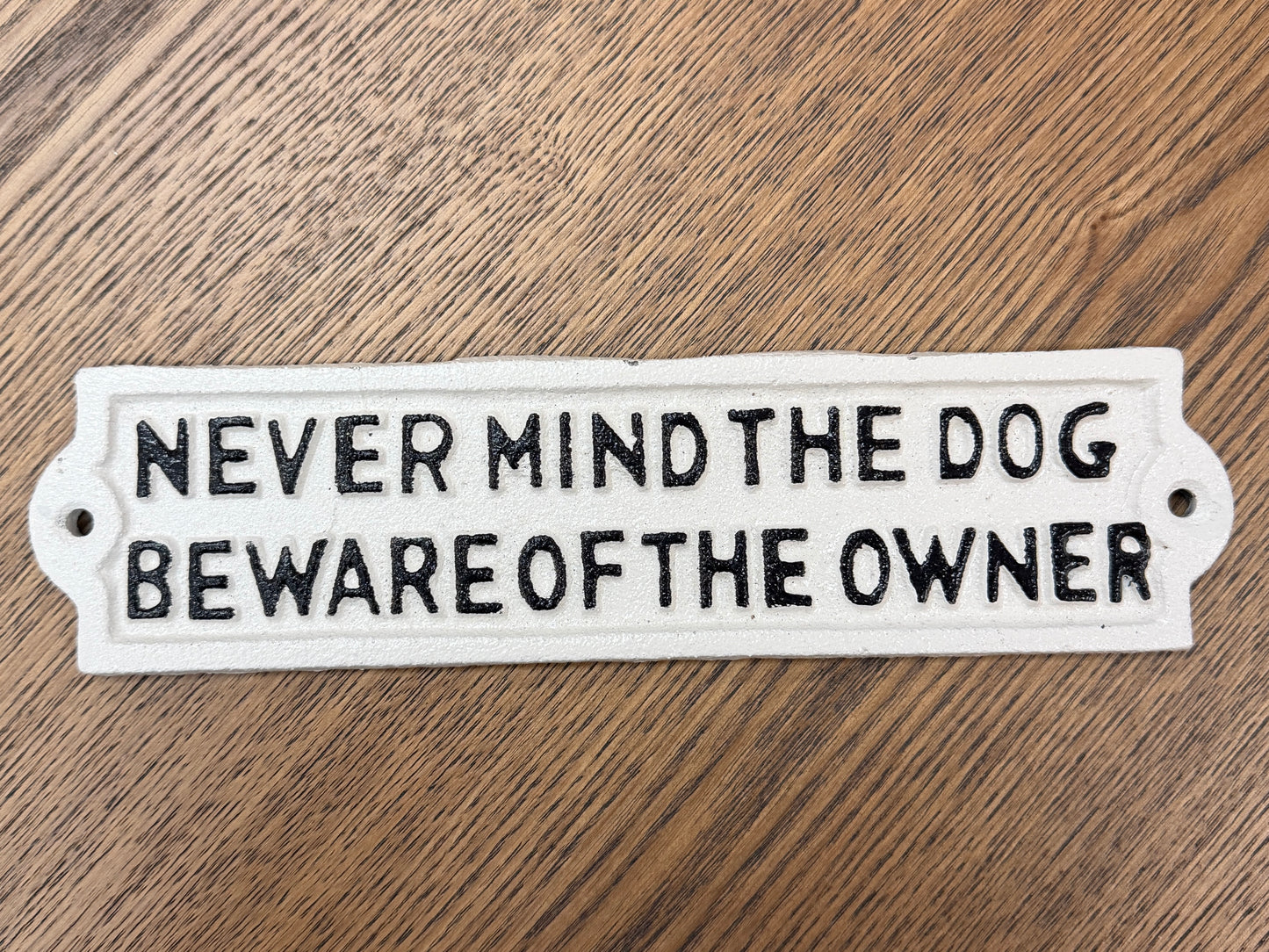Never mind the dog beware of the owner sign
