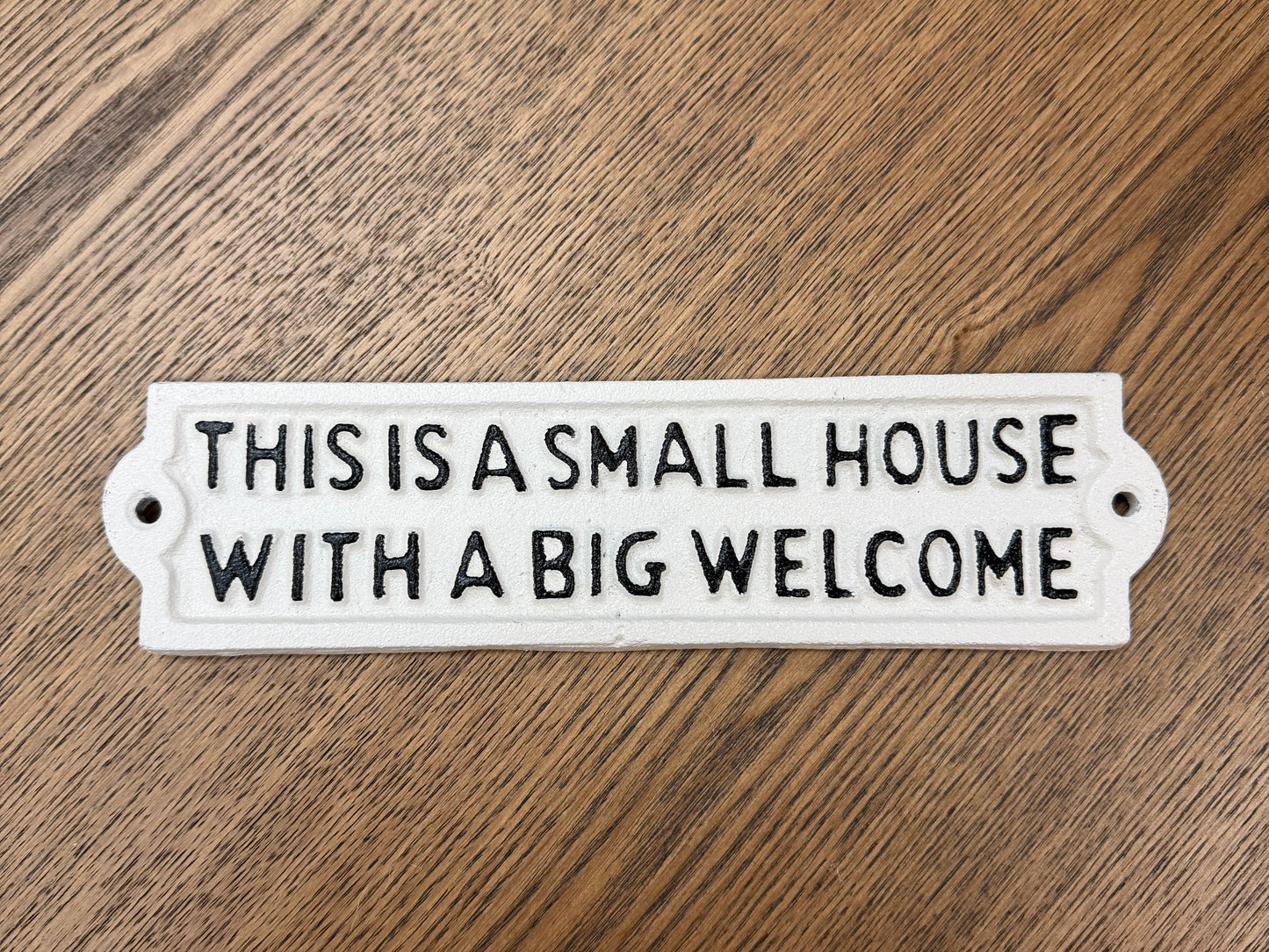 This is a small house with a big welcome sign