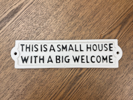This is a small house with a big welcome sign