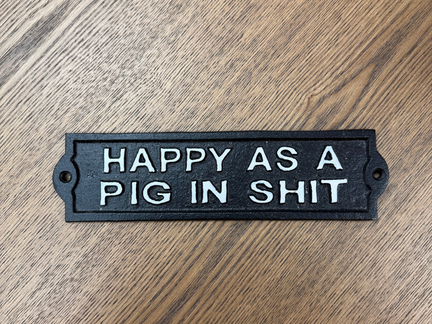 Happy as a pig in s**t sign