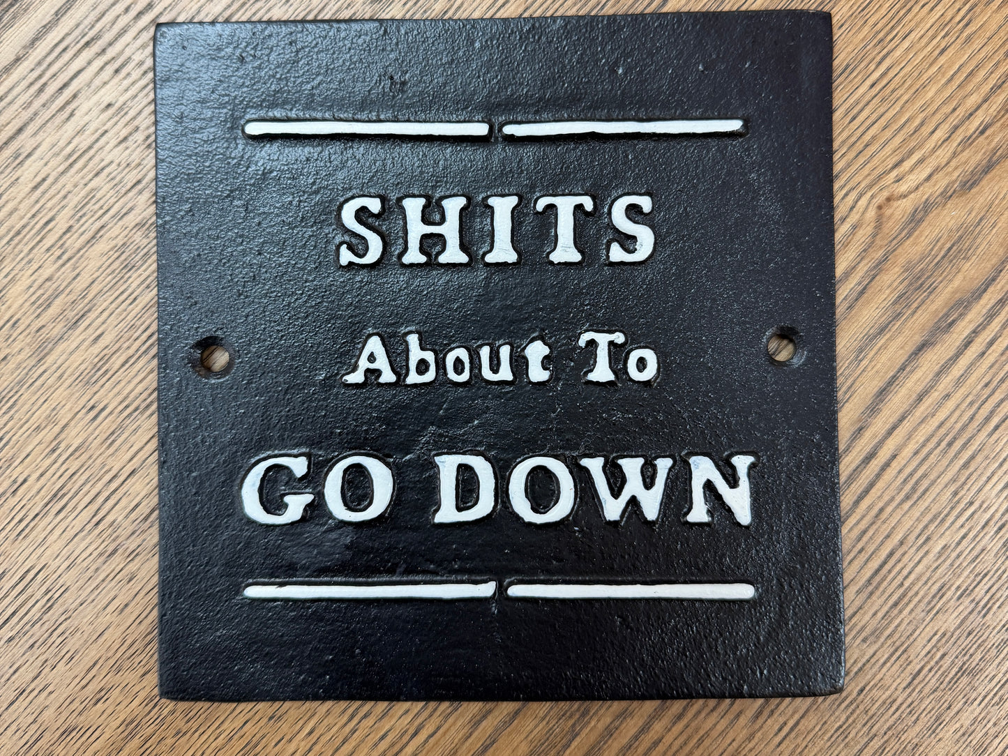 S**ts about to go down sign